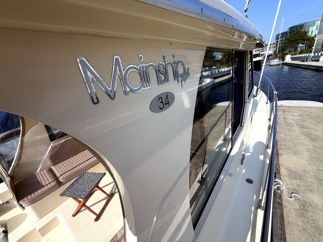 Detail of the Mainship 34 nameplate on Geronimo's hull